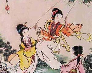 Elegantly-dressed young Chinese women of a time before the twentieth century playing outdoors, one of the swinging on a swing.