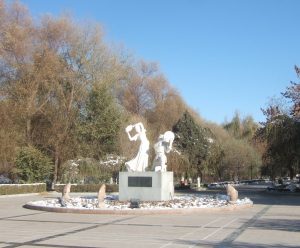 Sculpture of dancing musicians in a park in the centre of Hami, Xinjiang province, China on a sunny day 10th November 2012